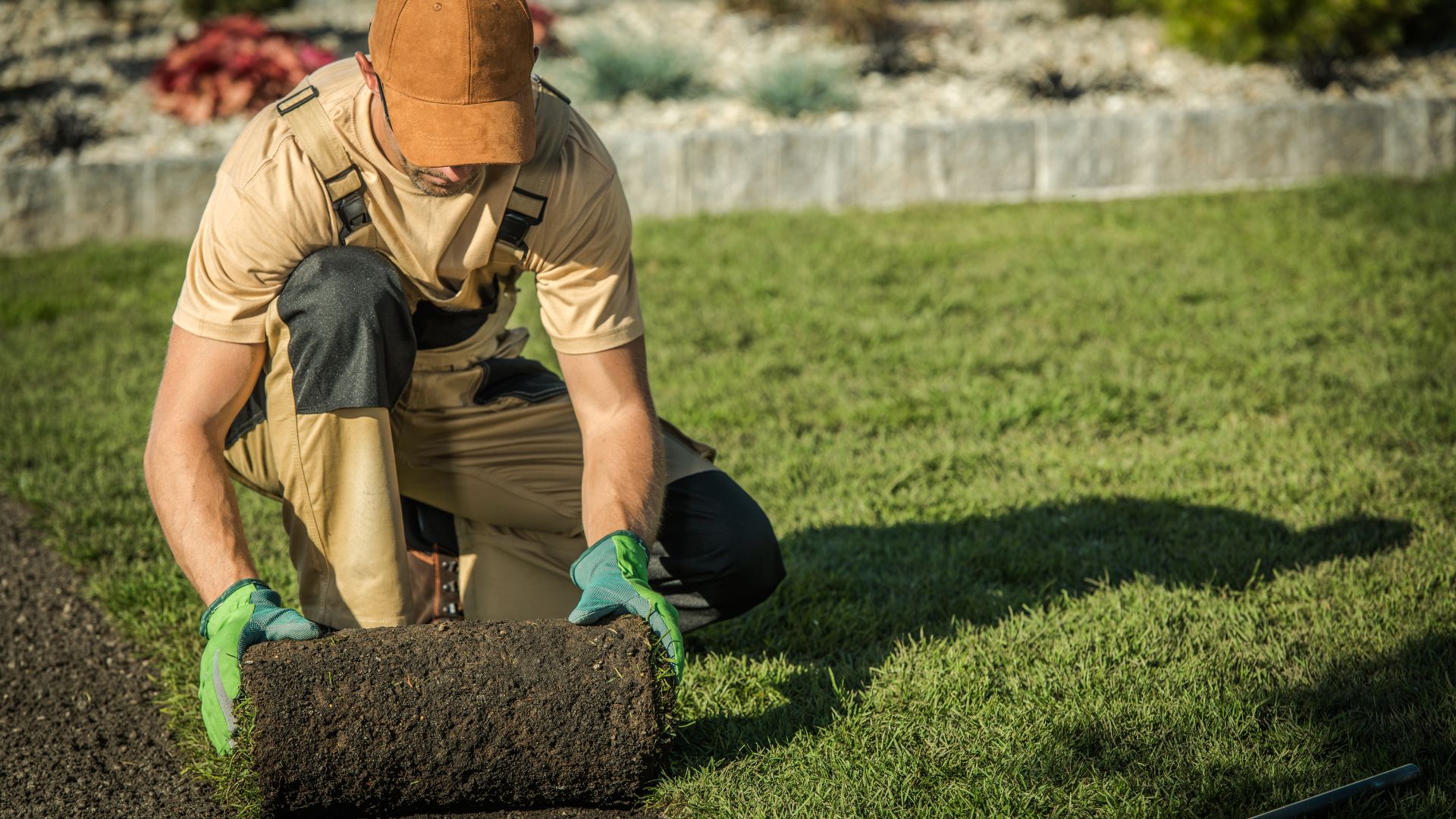 Team member laying sod with professional care